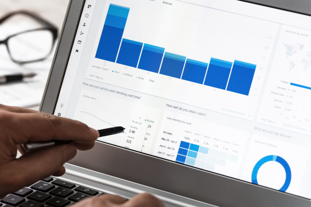 Modern technology concept showing web traffic analytics on an office touch screen notebook